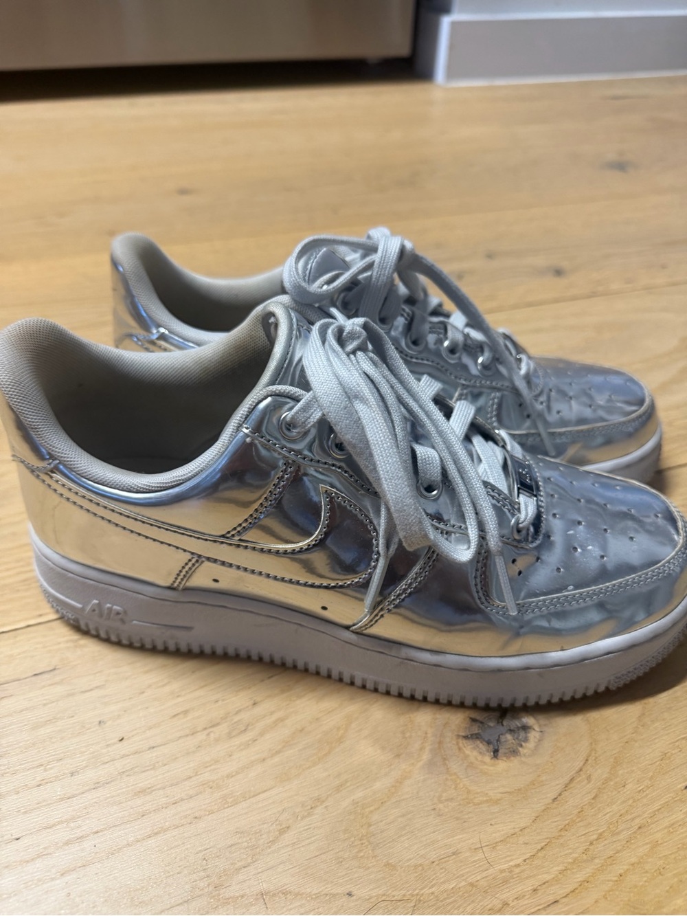 Nike Women’s Silver Metallic Air Force 1 Sneakers